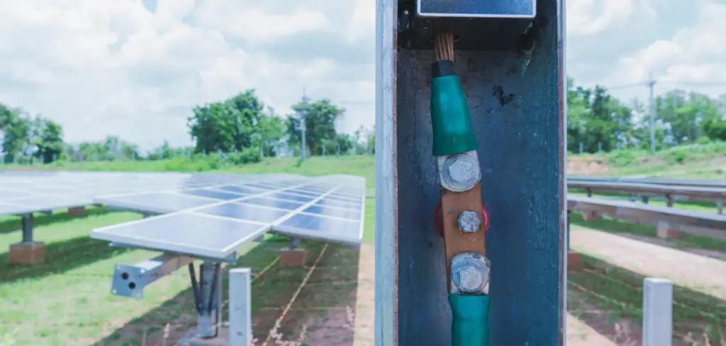 A lightning arrester safety device to protect a large solar array behind it.