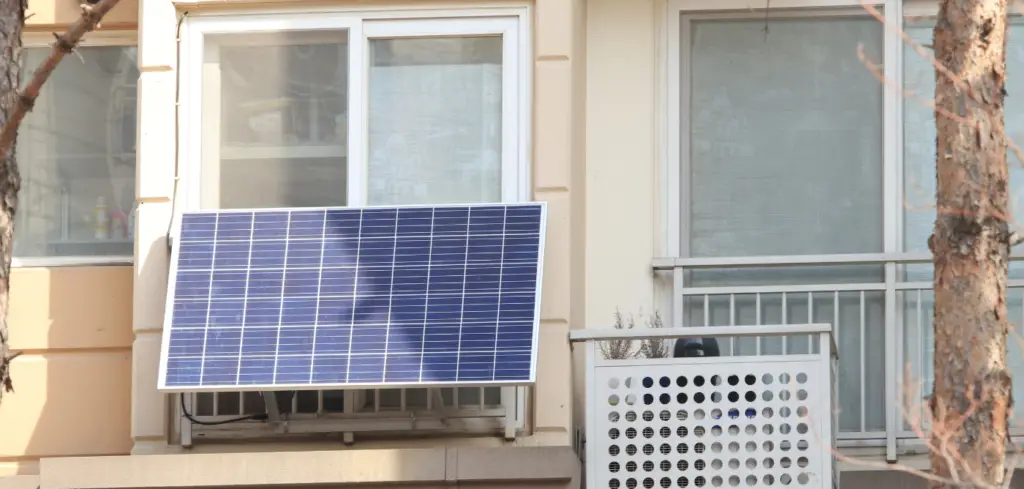 Solar panels installed on the outside of apartment window.