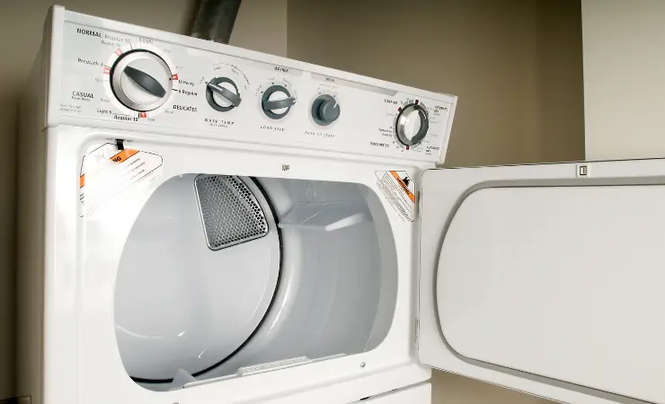 Large dryer appliance with door open showing empty contents.