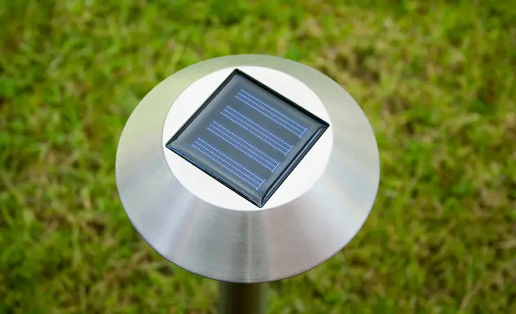 A single solar garden light with a top down angle that shows the small solar panel.